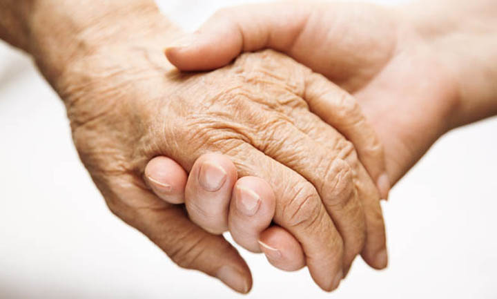 a-young-hand-holding-an-elderly-hand-665-x-400